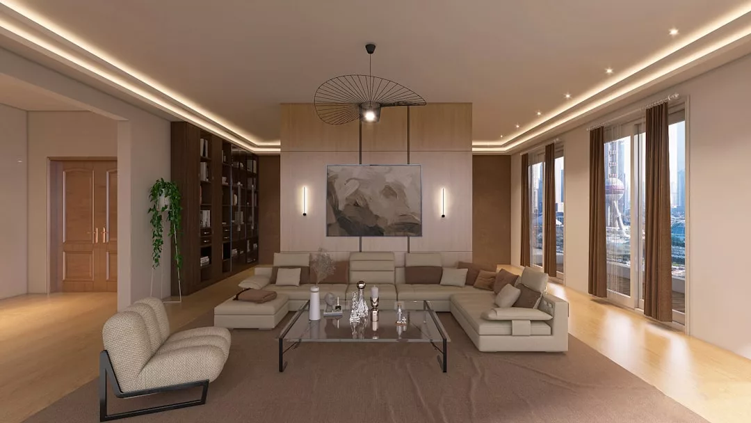 Una moderna sala de estar con sofás seccionales de color beige, mesa de centro de cristal, grandes obras de arte abstractas en la pared y ventanales con vistas al paisaje urbano de Mallorca, que captan la esencia del lujo y la elegancia contemporánea.